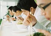 Business executives eating in cafeteria