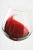 Swirling red wine in glass