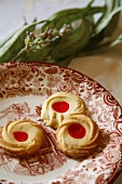 Three jam biscuits on a plate