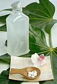 Schüßler-Salze, Blatt, Flasche und Orchideenblüten
