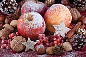 Christmas decorations with fruit, nuts, pine cones and spices