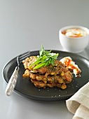 Mussel and corn cakes with sour cream and chilli sauce