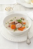A simple soup with sausages and vegetables