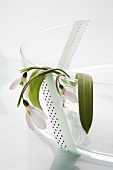 Snowdrops in a glass bowl decorated with masking tape