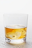 Whisky and ice cubes in a glass