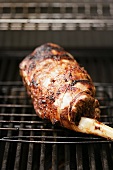 A leg of lamb on a barbecue