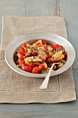 Potato and spinach dumplings with tomato sauce