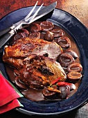 Pork neck in a spicy chocolate and damson sauce