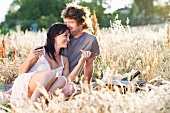 Couple picnicking in wheatfield