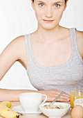 Young woman with large breakfast