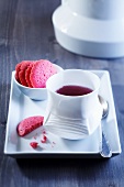 Fruit tea with raspberry biscuits
