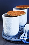 Waffle biscuits and tea in Dutch cups decorated with windmills