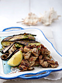 Crispy fried chicken meat with aubergines
