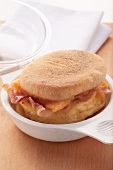Bacon and melted cheese in an English muffin