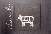 A sketch of a lamb on a chalkboard