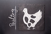 A sketch of a chicken on a chalkboard