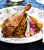 Wheat risotto with saffron chicken and shallots
