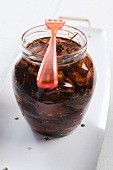 A jar of dried tomatoes