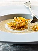 Cream of parsnip soup garnished with fried parsnips