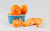 Whole and peeled clementines