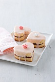 Heart-shaped biscuits decorated with icing sugar