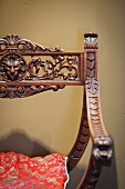 Detail wood carved x chair