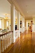 Traditional hallway in home with red oak hardwood floors