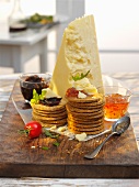 Crackers and dips with cheddar cheese on a table