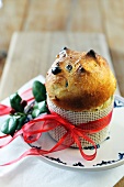 Mini panettone tied with ribbon on a plate