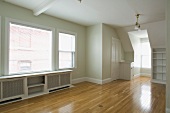 Empty room in apartment with hardwood floor