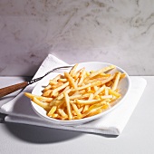 A plate of chips with a fork
