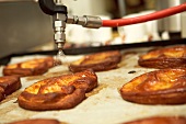 Pastries being sprayed with water