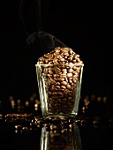 A glass of roasted coffee beans