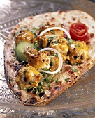 Kasturi Kebabs (grilled chicken kebabs, India) on naan bread