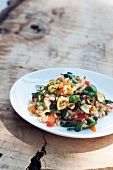 Wholemeal risotto with purslane, courgettes and tomatoes