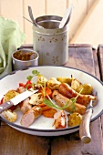 Mini bratwurst with roasted vegetables and mustard