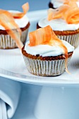 Carrot cupcakes topped with cream cheese