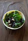 Rocket salad with squares of chocolate, Gorgonzola and pistachios