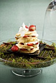 Strawberry shortcake on a bed of moss in a glass dish