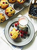 Berry muffins and glass of milk