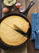 Cornbread in a Cast Iron Skillet; Slice Removed; From Above
