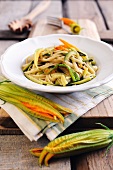 Fresh egg tagliolini with sliced courgettes and courgette flowers