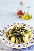 Green beans with potatoes and sauteed spring onions