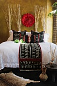 Black white and red decorative pillows and bed runner