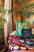 Colorful throw pillows on bed