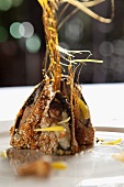 Crispy beef roll with banana and caramel strands (China)
