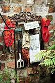 Garden tools and shoes hanging in the courtyard