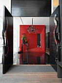 Modern entrance foyer with red wall