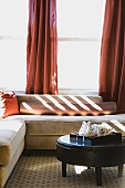 Sunlit Sofa in Room with Red Accents