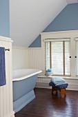 Tranquil, spartan bathroom in pastel blue and white